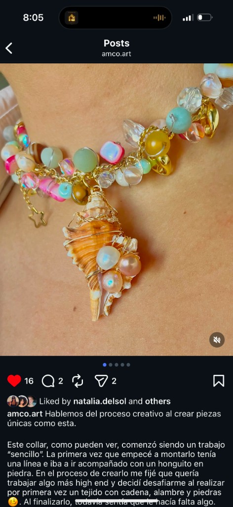 Colorful handmade choker necklace with a large seashell pendant, pearls, and crystals.